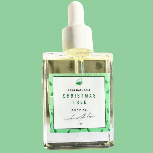 A bottle of Lex Naturals Christmas Tree Body Oil with a white cap and a label featuring green and white design and text.