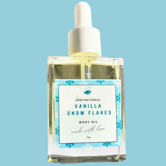 A bottle of Lex Naturals Vanilla Snow Flakes Body Oil with a white cap and a label featuring blue and white floral design and text.